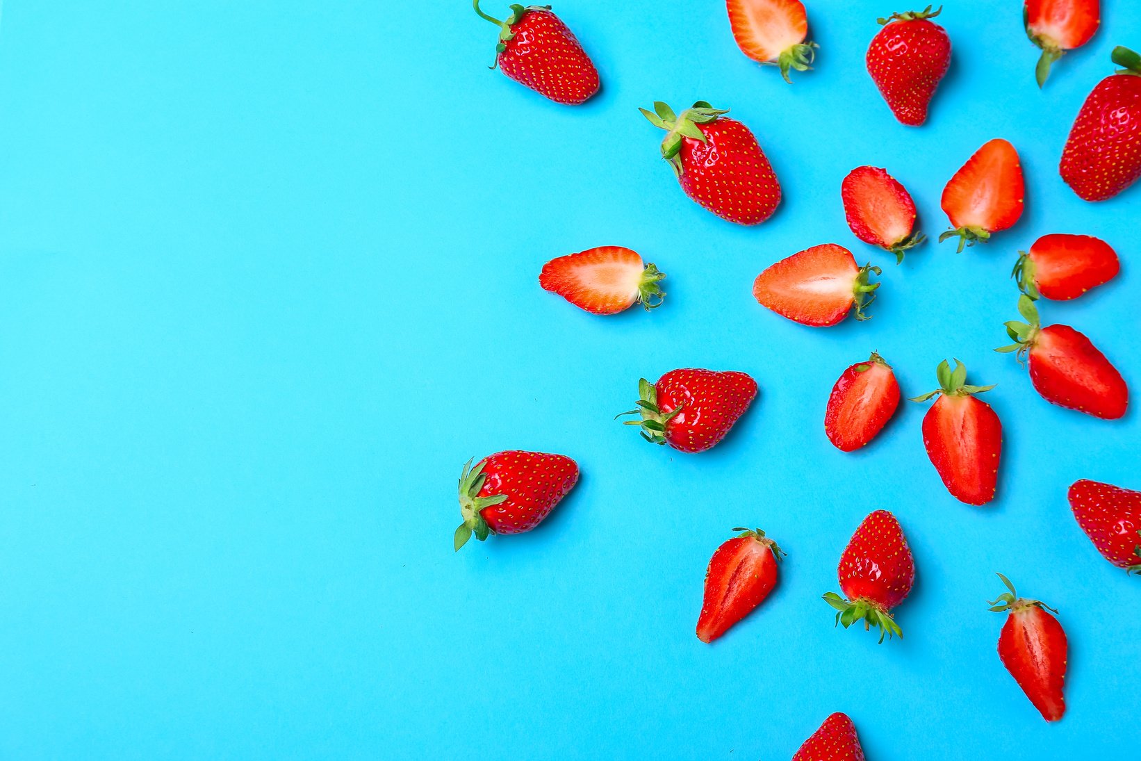 Ripe Strawberry on Blue Background